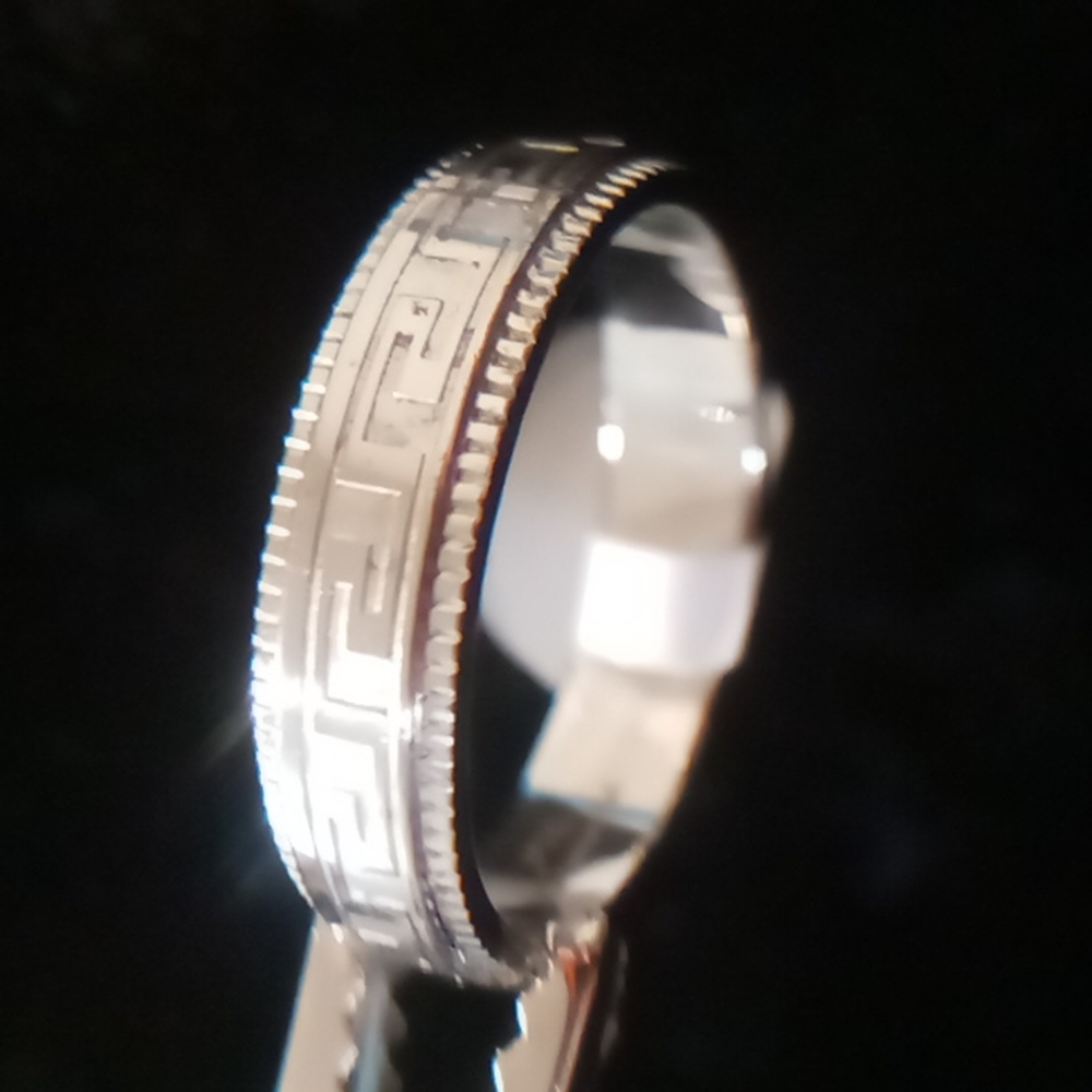 Aztec design wedding band.New with tags by JFSG. In 316 stainless steel.